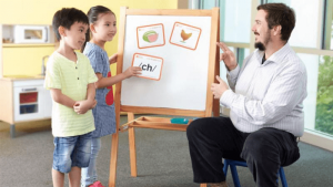 Teacher teaching phonics in enrichment centre