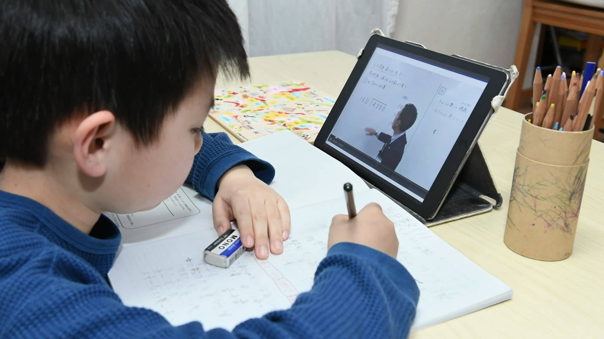 Boy in Singapore doing online learning and online tuition classes in Singapore during home based learning