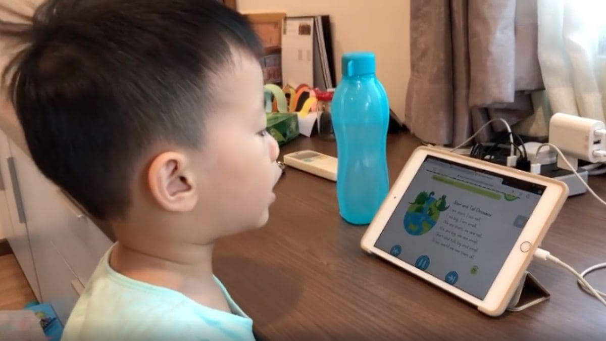 Pre school child in Singapore doing his home based learning