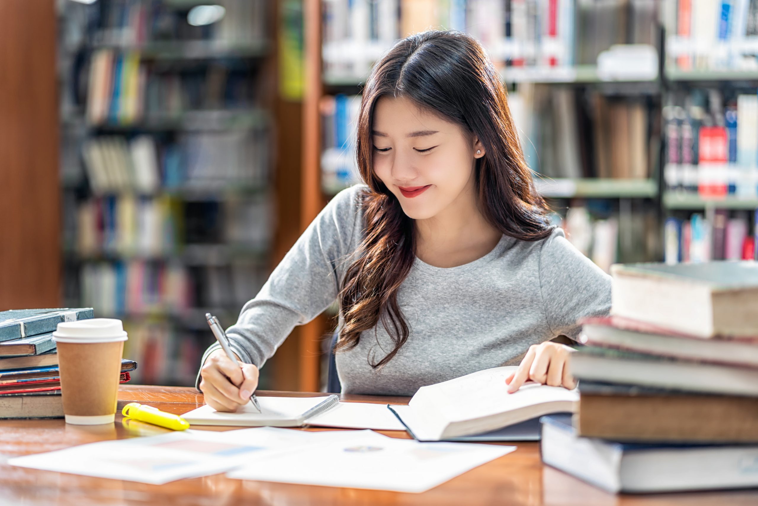 Asian Young Student In Casual Suit Reading And Doing Homework In 