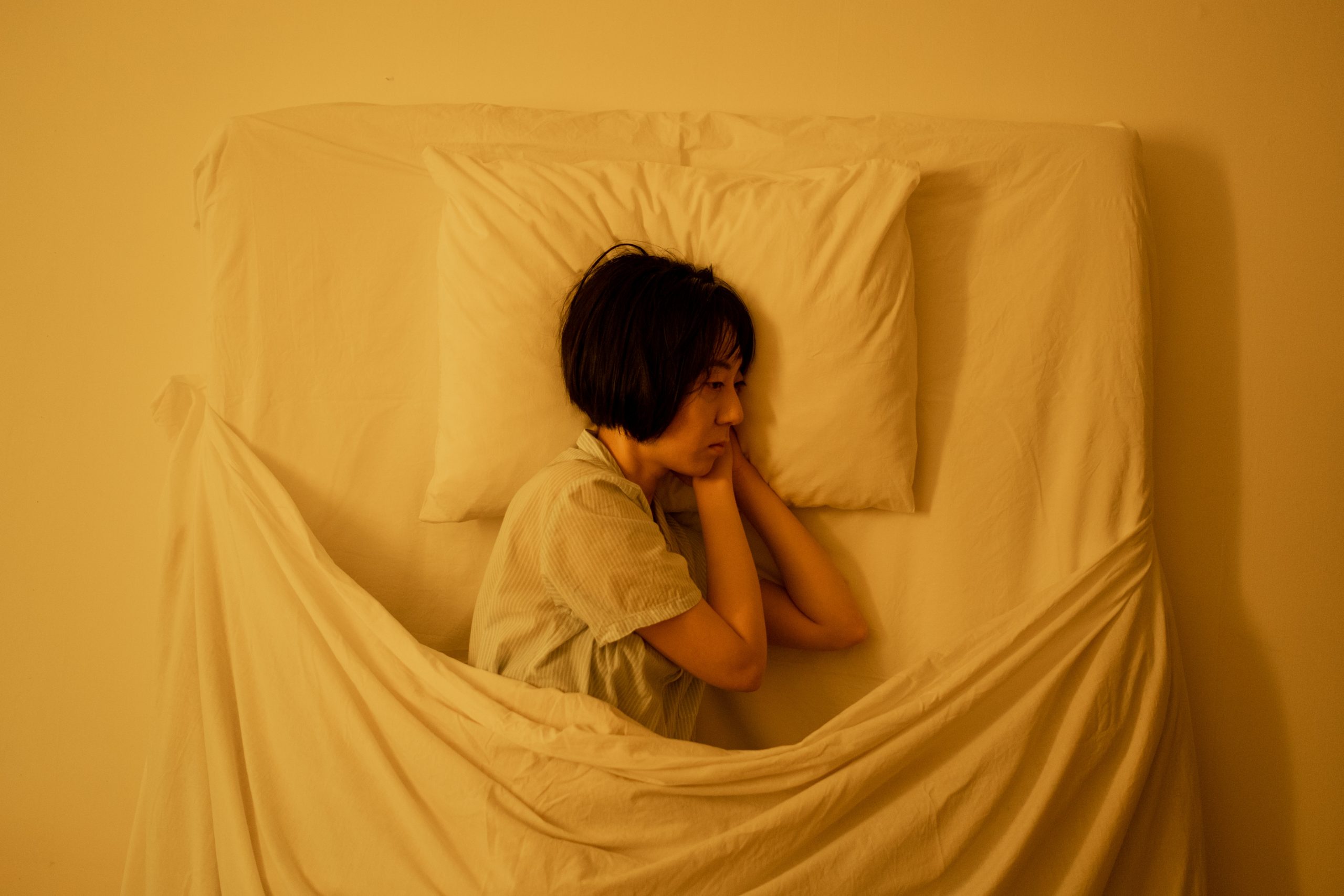 Woman Not Being Able To Sleep On Her Bed